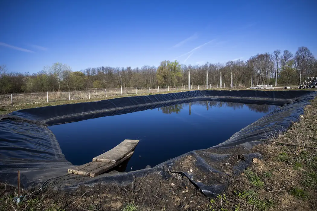 Windmill powered landfill leachate systems